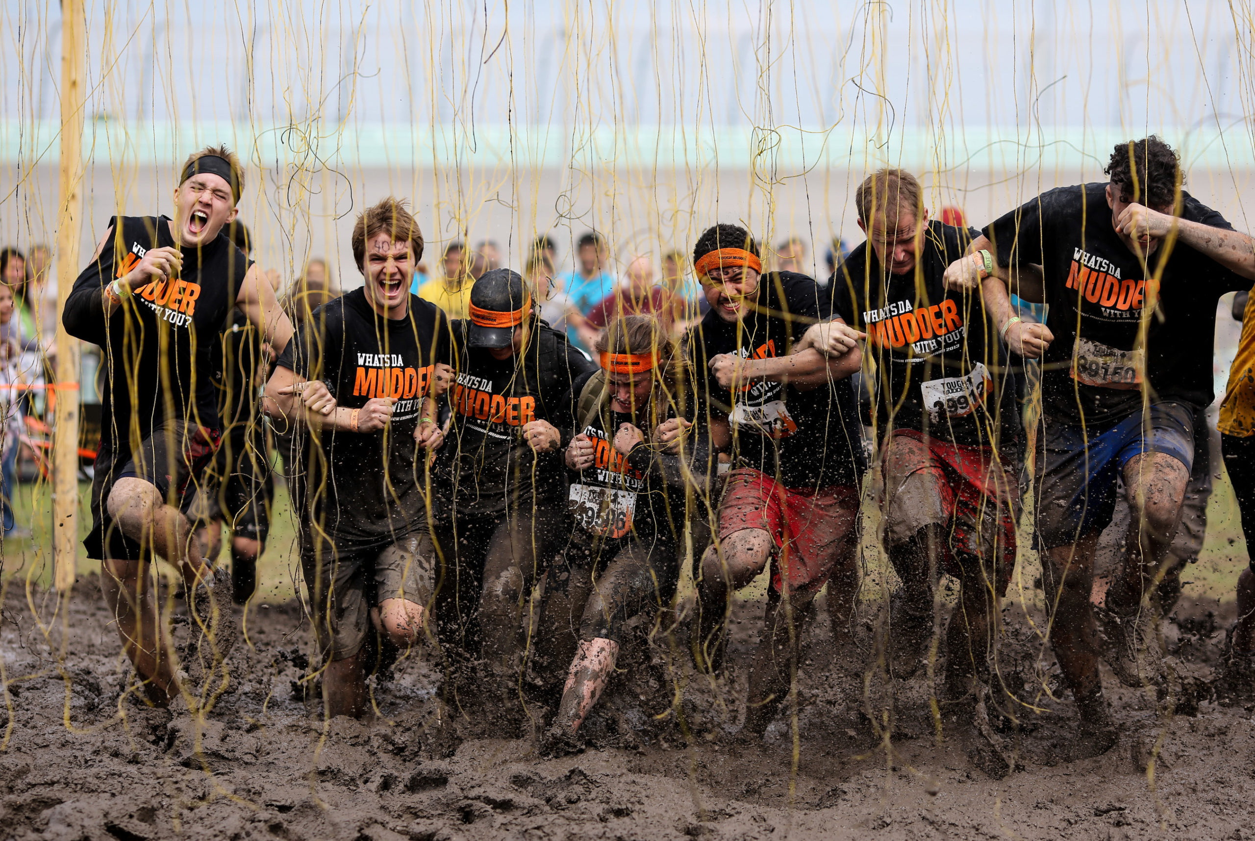 Participants clinging to each other as they walk through Electroshock Therapy