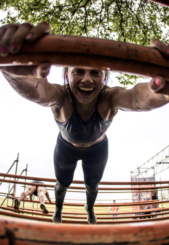 Tough Mudder participant smiling.