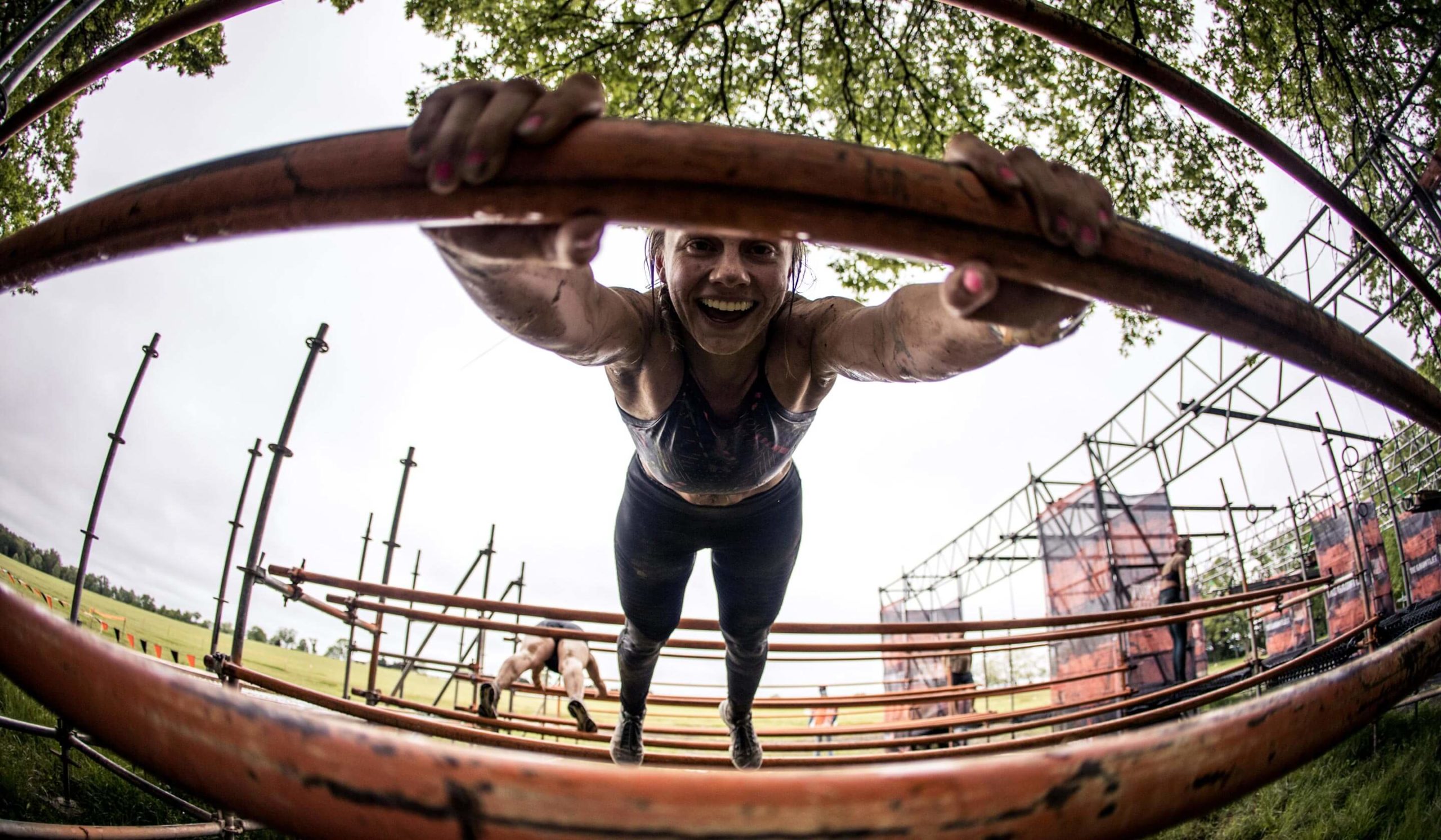 Tough Mudder participant smiling.