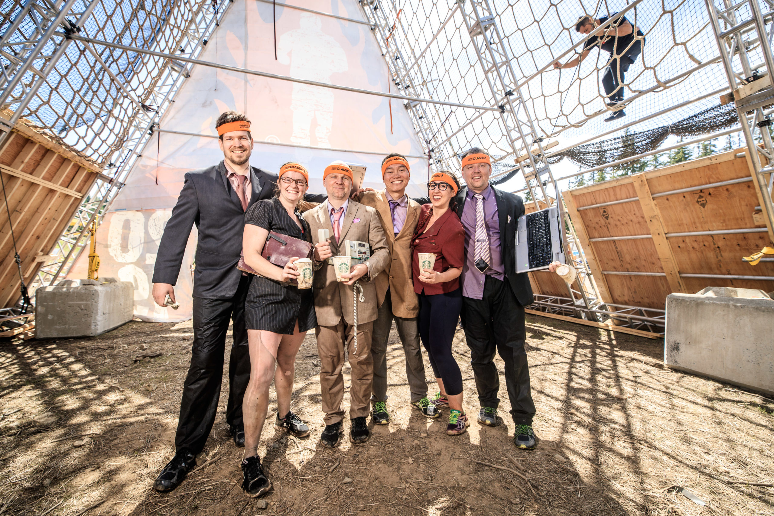 Participants wearing their office attire in Tough Mudder event place