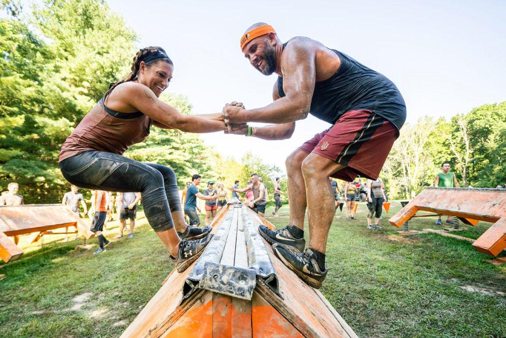 participants on balance obstacle ,at Tough Mudder