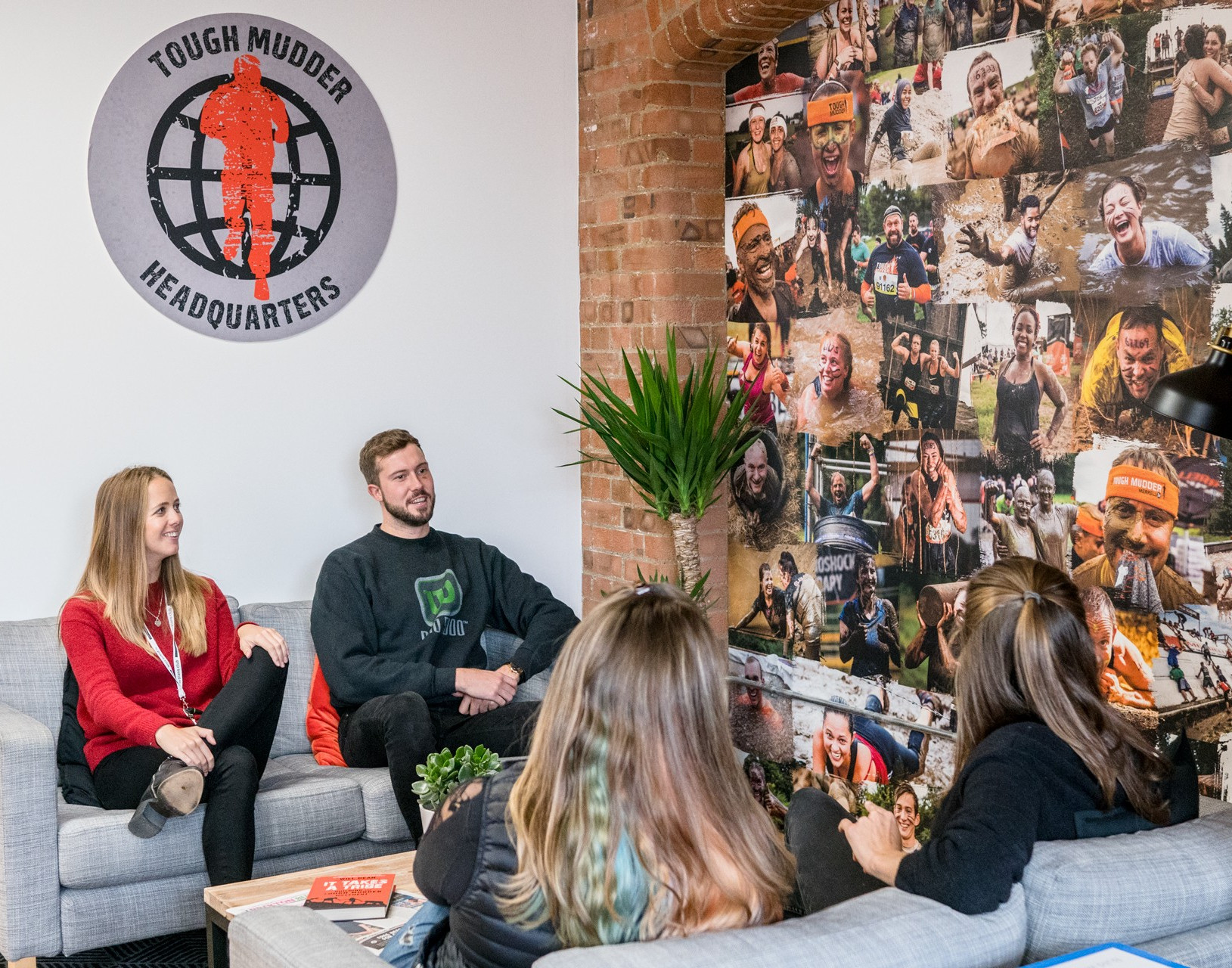 People chatting in Tough Mudder Headquarters