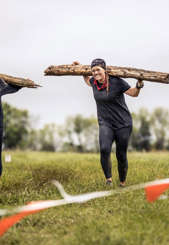 Log Carry participants smiling.