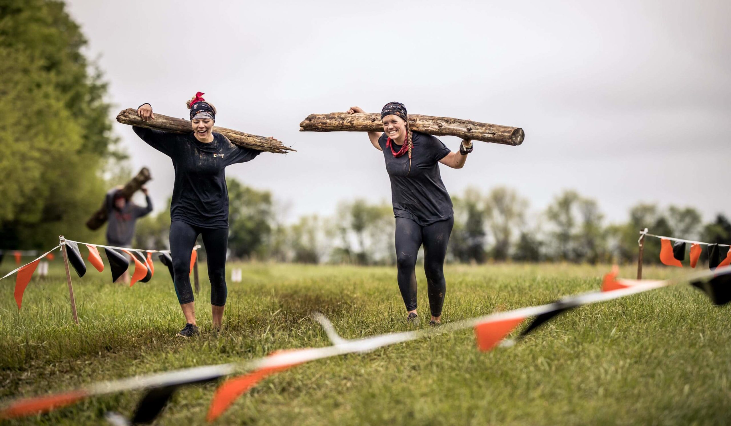 Log Carry participants smiling.