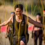 Participant smiling while running through Electroshock Therapy
