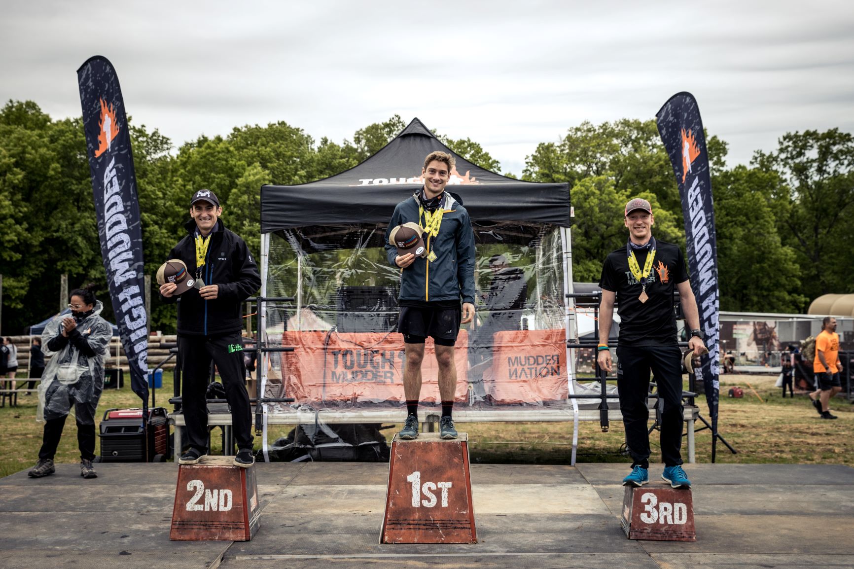 Top participants standing in the 1st, 2nd, & 3rd platform for a picture