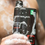 Man holding Every Man Jack body wash
