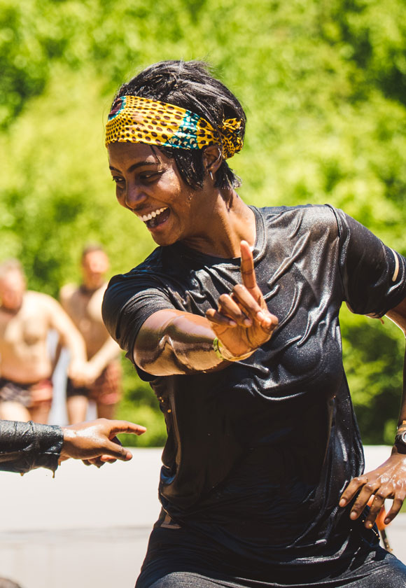 Participant smiling and pointing her finger forward
