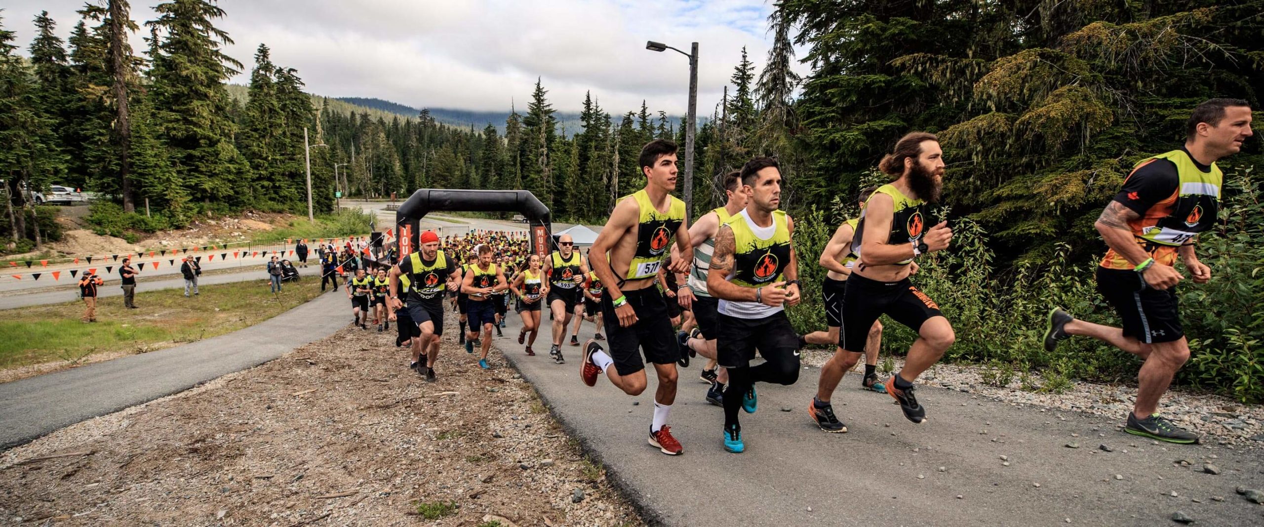 Participants running in an uphill road