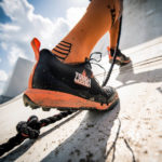 Climbing an obstacle in new Tough Mudder sneakers