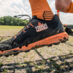 Participant jumping, shot focused on his Tough Mudder shoe