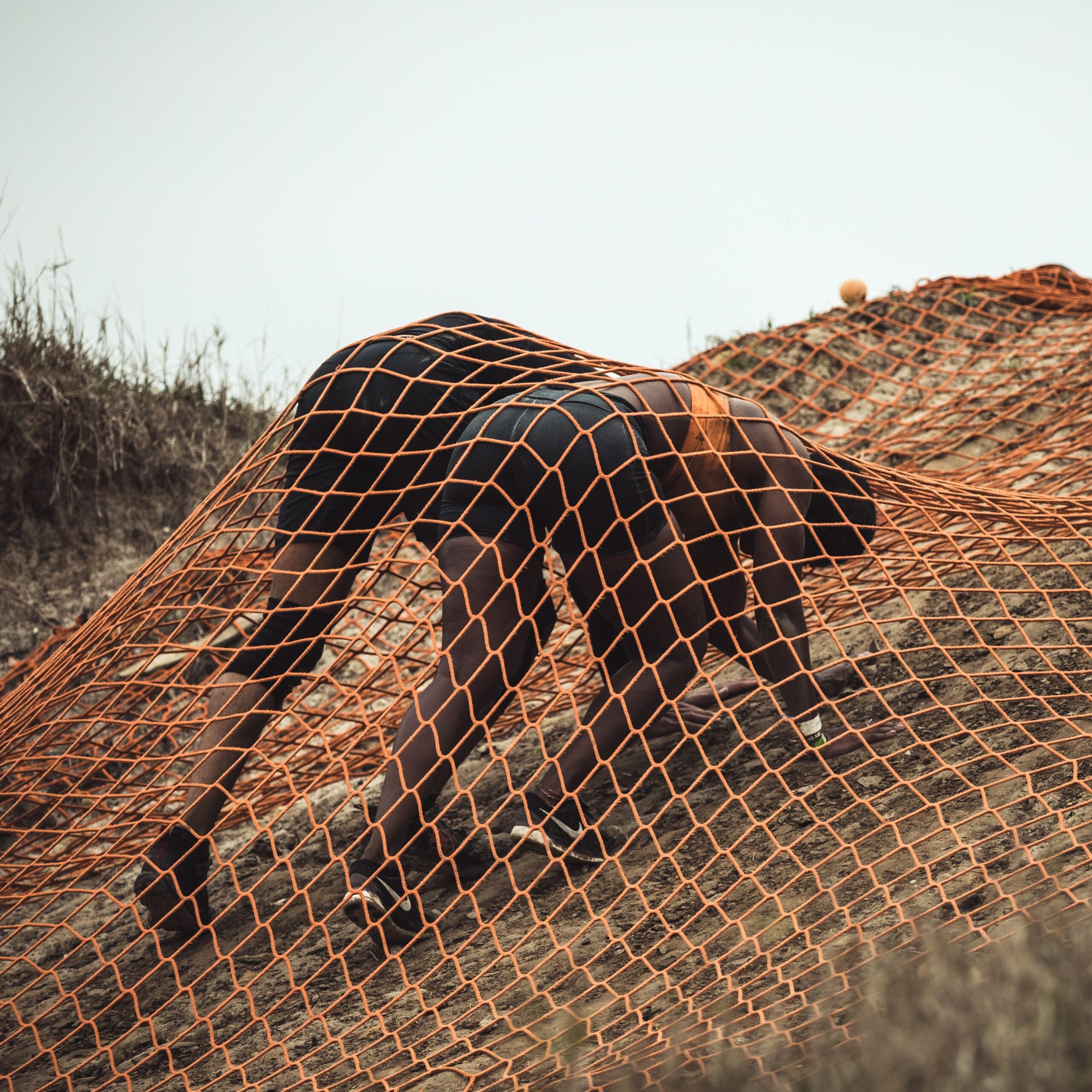 Mudders trying to lift the heavy net of Devil