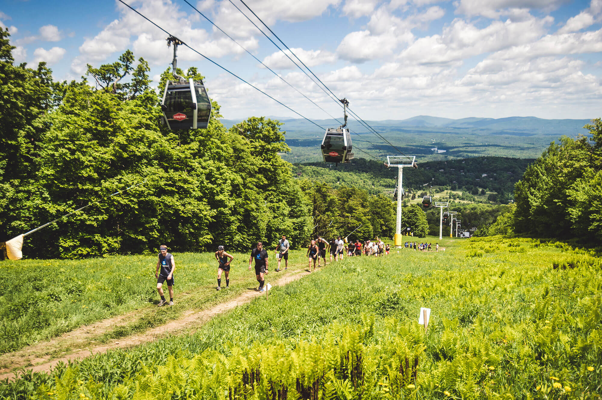 Mudders walking in the beautiful terrain