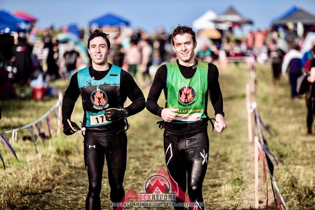 two men running at Tough Mudder endurance