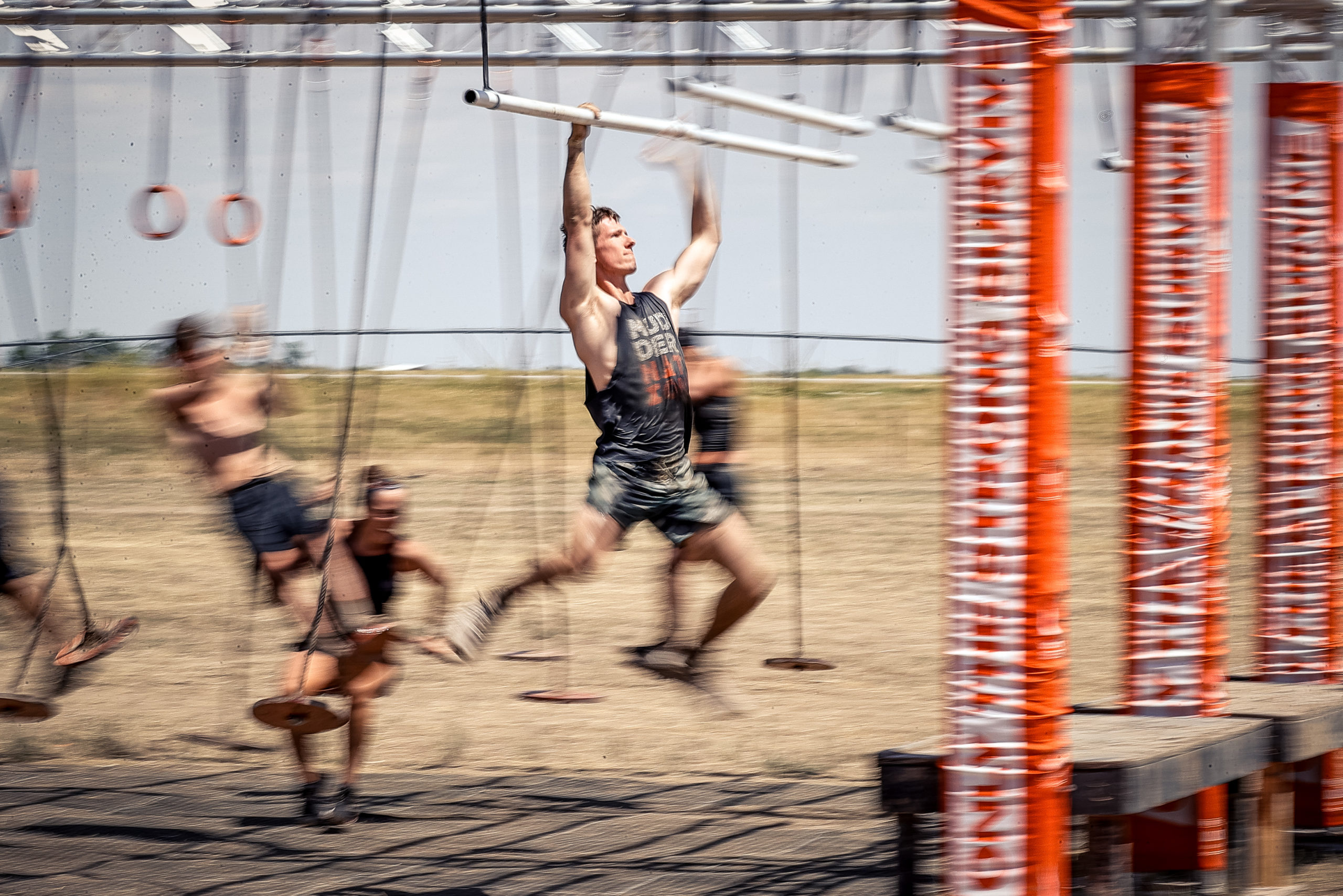 A man holding on the bars
