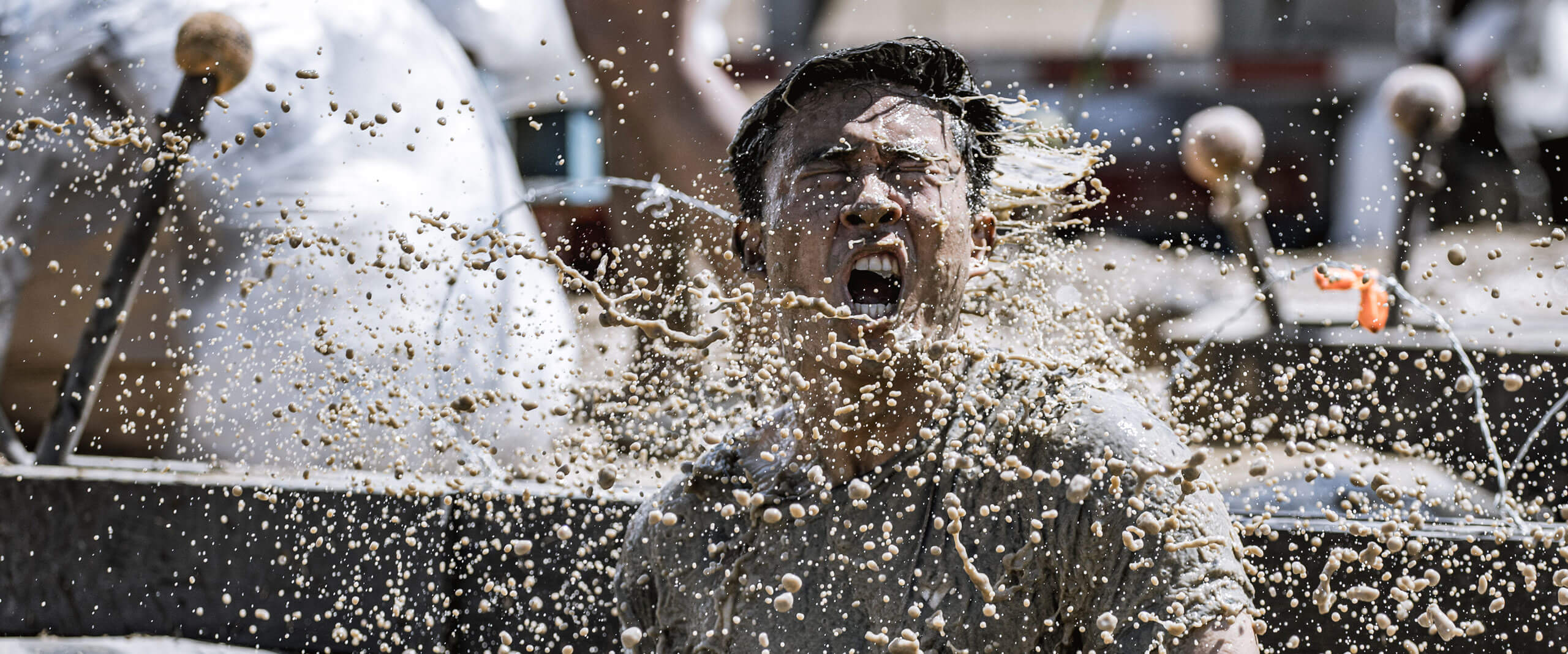 A man shaking off the cold water from Arctic Enema