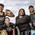 A team of mudders posing for a picture