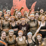 Mudders smiling for a picture after the race
