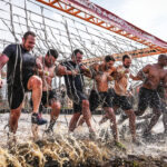 Men linking arms while crossing the Electroshock Therapy