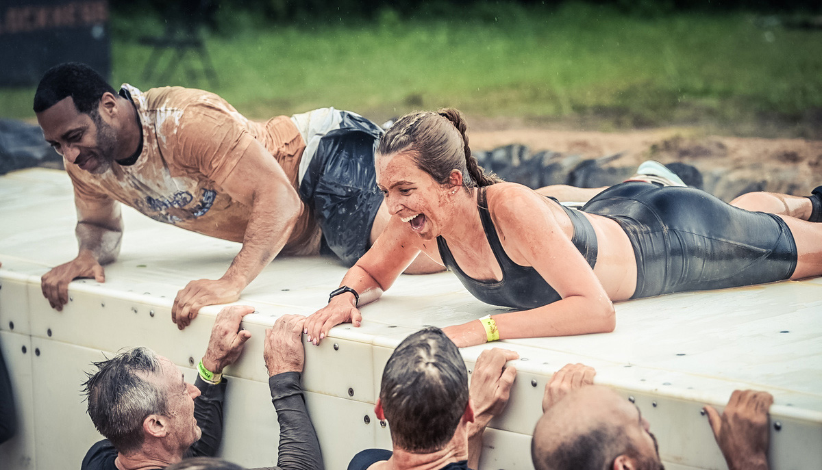 Man and woman happily sliding on the ramp