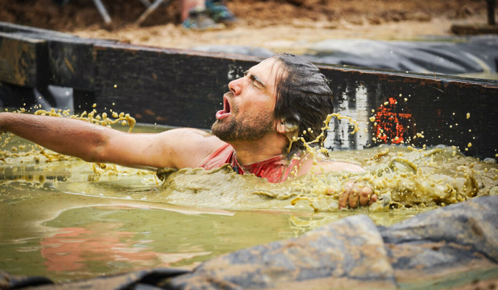 A participant gasping for air in the icy water