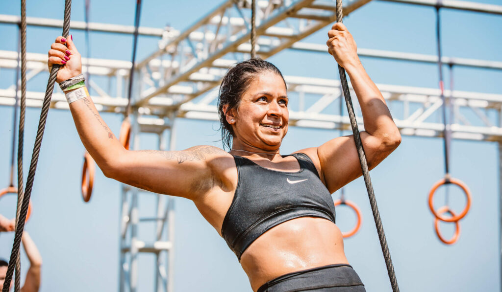A participant holding on the ropes